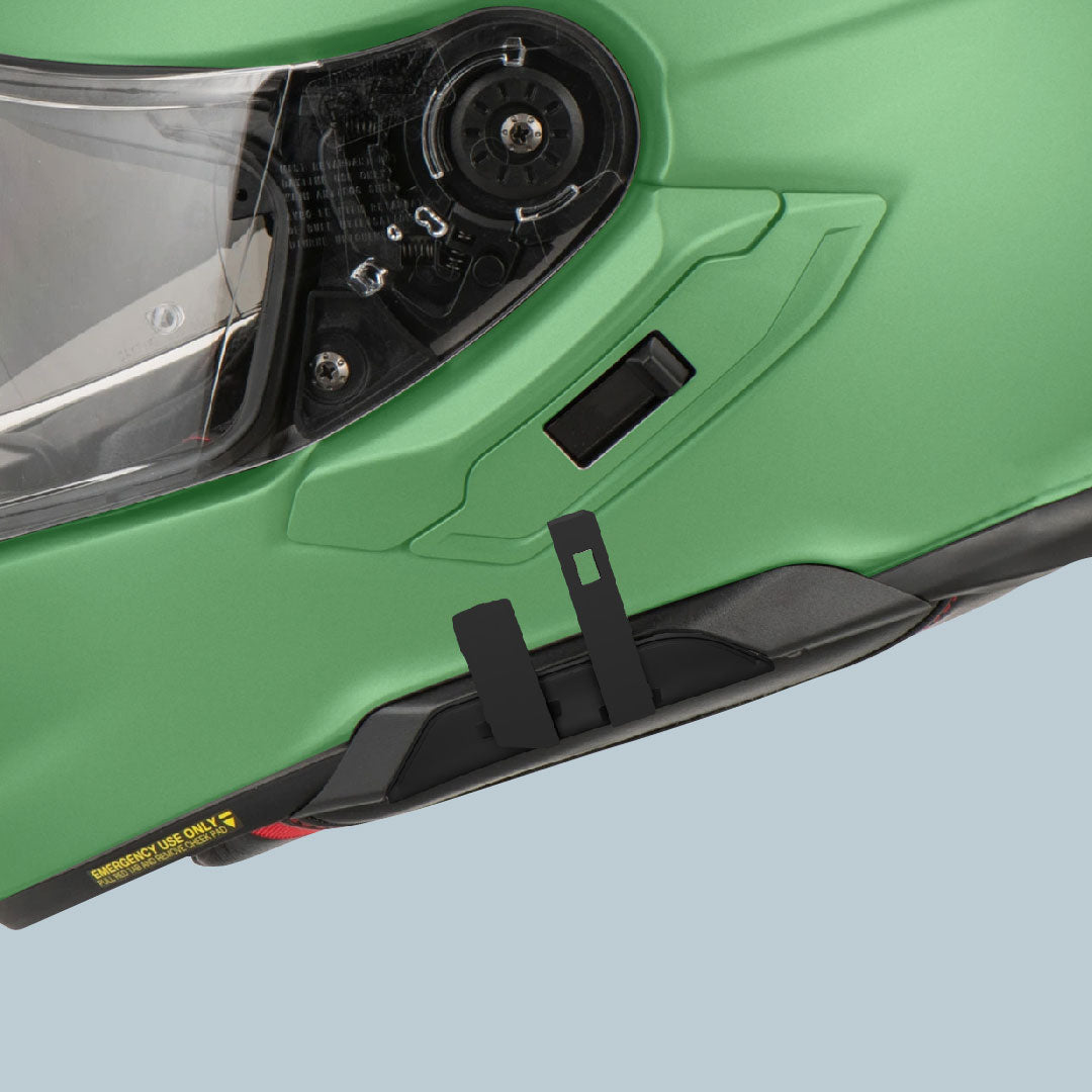 Close-up of Generation 3 intercom mount on a green Shoei helmet for GT-Air 3 and Neotec 3 compatibility.